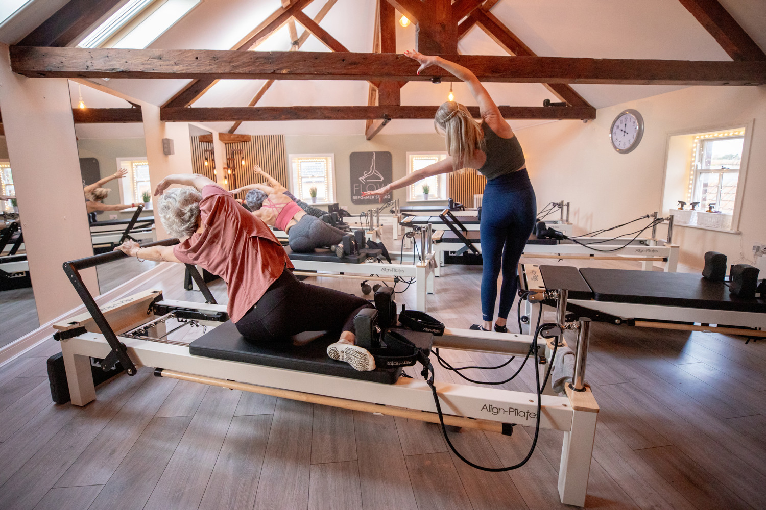 Instructor demonstrating movement at Flow Reformer Studio Bottesford